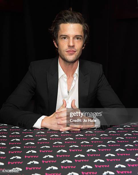 Brandon Flowers poses and signs copies of his New Album 'The Desired Effect' for Fans at at HMV Oxford Street on May 22, 2015 in London, England.