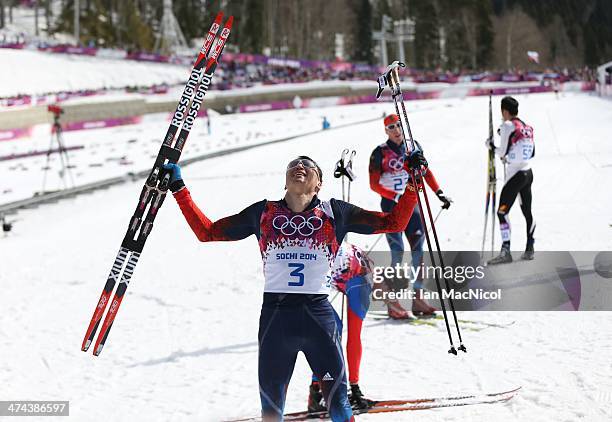 Alexander Legkov of Russia celebrates after he wins the Men's 50km Mass Start Free on Day 16 of the Sochi 2014 Winter Olympics at Laura Cross-country...