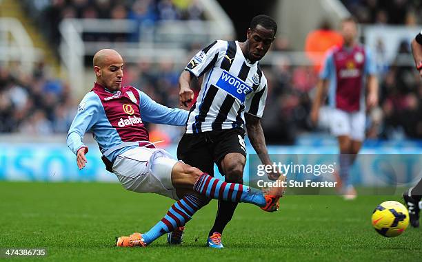 Newcastle player Vernon Anita challenges Karim El Ahmadi of Aston Villa during the Barclays Premier League match between Newcastle United and Aston...