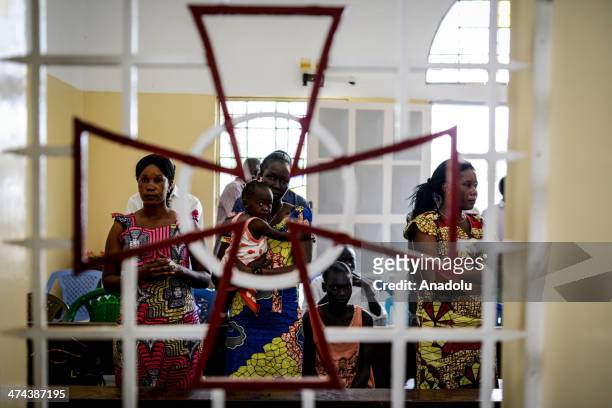 Catholic Sudanese people pray for the peace during the religious ceremony in Juba, South Sudan on February 23, 2014. Due to the conflict between...