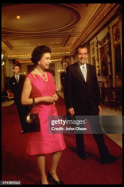 Queen Elizabeth II with US President Richard Nixon , followed by Princes Charles and Philip, at Buckingham Palace, London, 25th February 1969.