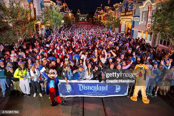 In this handout photo provided by Disney Parks, GET READY TO BE DAZZLED, Disneyland park guests count down to a 24-hour party that kicks off the...