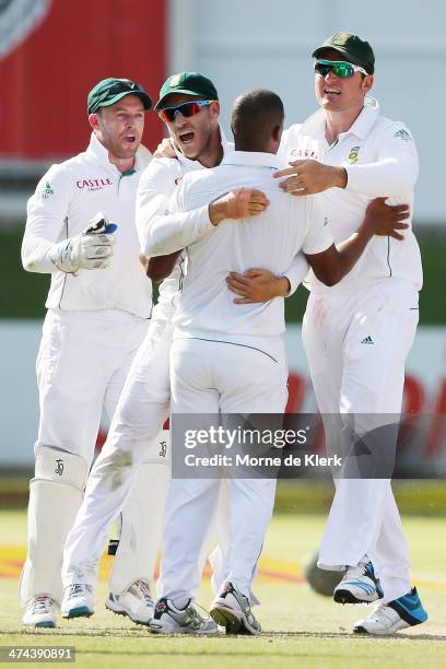 South African players celebrate with Vernon Philander after he got the wicket of Shaun Marsh of Australia during day four of the Second Test match...