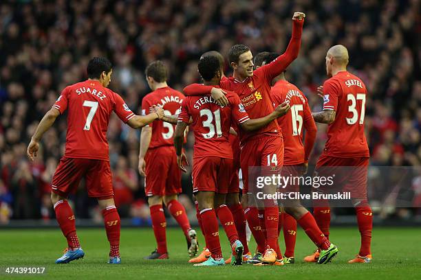 Jordan Henderson of Liverpool celebrates scoring the second goal with his team-mates during the Barclays Premier League match between Liverpool and...