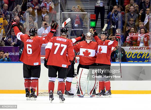 Shea Weber, Jeff Carter, Carey Price and Jonathan Toews of Canada celebrate after defeating Sweden 3-0 during the Men's Ice Hockey Gold Medal match...