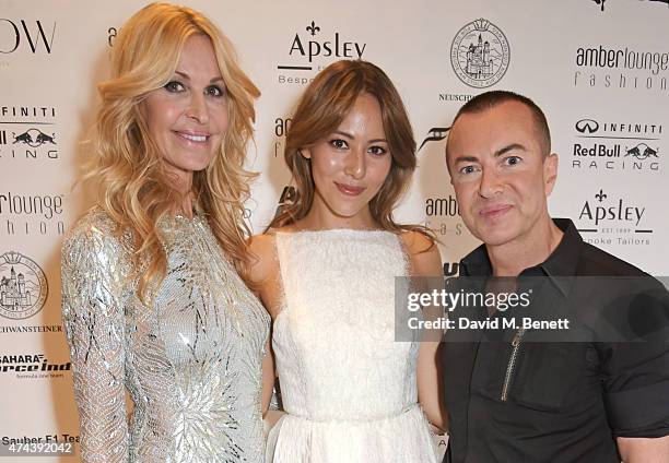 Jessica Michibata poses with designers Melissa Odabash and Julien Macdonald at the Amber Lounge 2015 Gala at Le Meridien Beach Plaza Hotel on May 22,...