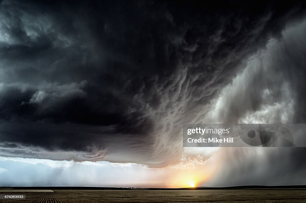 Developing storm over farmland