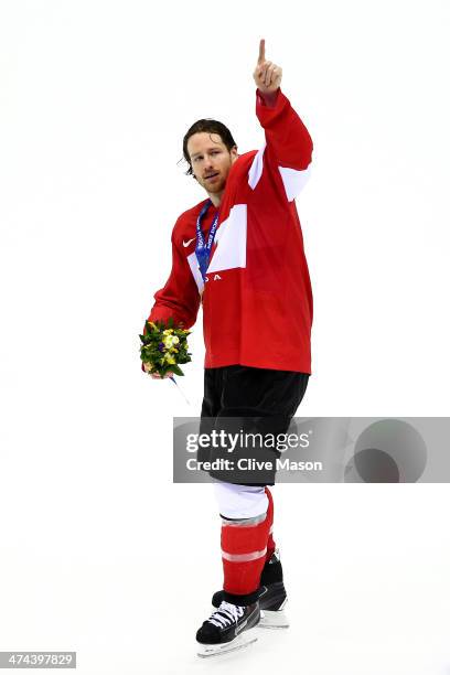 Duncan Keith of Canada celebrates with his gold medal following his team's 3-0 victory during the Men's Ice Hockey Gold Medal match against Sweden on...