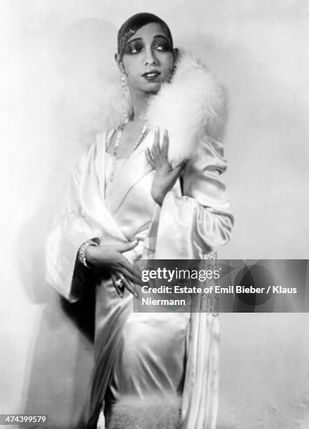 American-born French dancer, singer and actress Josephine Baker wearing a satin outfit with fur trim, Hamburg, 1925.