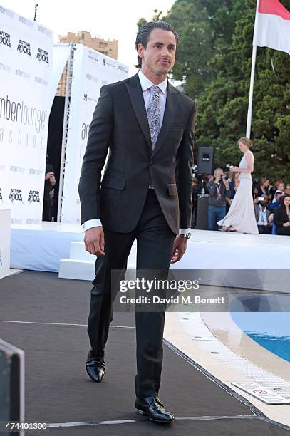 Racing driver Adrian Sutil walks the runway at the Amber Lounge 2015 Charity Fashion Show in benefit of Autism Rocks at Le Meridien Beach Plaza Hotel...