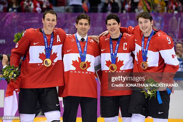 Canada's gold medallists Jonathan Toews, John Tavares, Sidney Crosby and Matt Duchene pose during the Men's Ice Hockey Medal Ceremony at the Bolshoy...