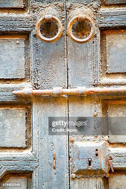 rusty   in   the old wood  facade home and safe padlock