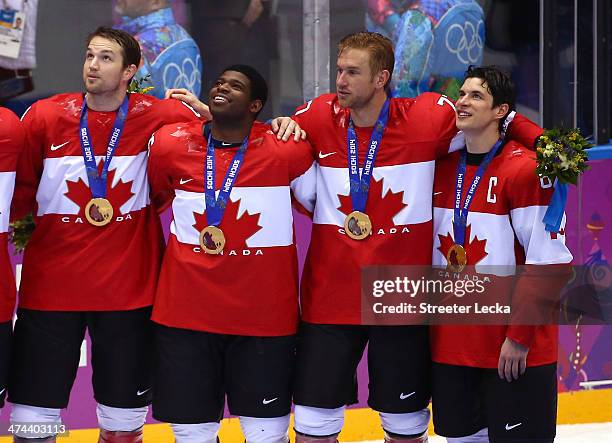 Gold medalists Rick Nash, P.K. Subban, Jeff Carter and Sidney Crosby of Canada celebrate during the medal ceremony after defeating Sweden 3-0 during...