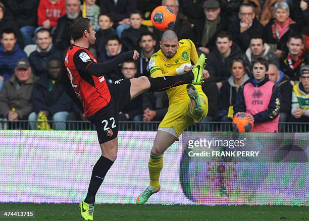 Rennes' French defender Sylvain Armand vies for the ball with Nantes' French midfielder Vincent Bessat during the French L1 football match between...