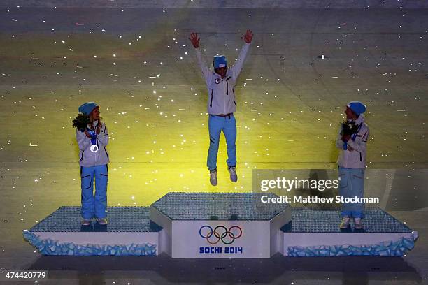 Silver medalist Therese Johaug of Norway, gold medalist Marit Bjoergen of Norway and bronze medalist Kristin Stoermer Steira of Norway celebrate in...