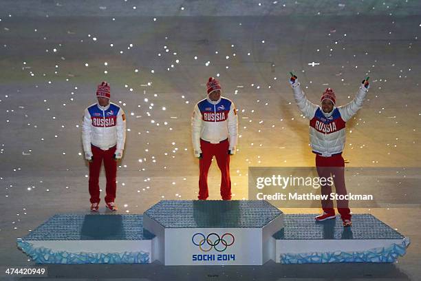 Silver medalist Maxim Vylegzhanin of Russia, gold medalist Alexander Legkov of Russia and bronze medalist Ilia Chernousov of Russia celebrate in the...