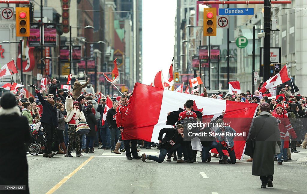 Canadian fans celebrate the men's hockey Olympic gold medal