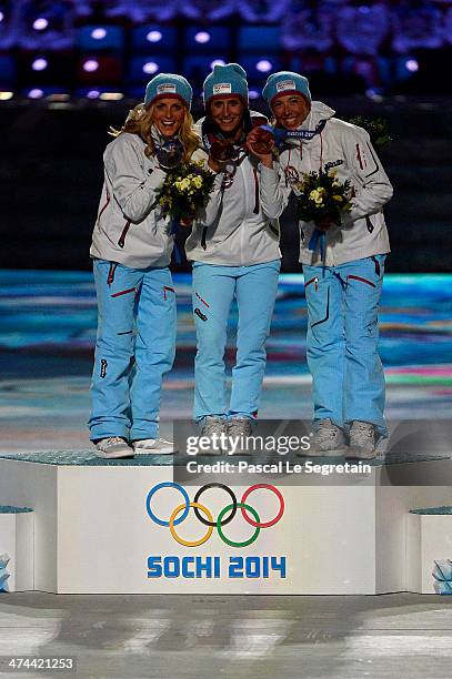 Silver medalist Therese Johaug of Norway, gold medalist Marit Bjoergen of Norway and bronze medalist Kristin Stoermer Steira of Norway celebrate...