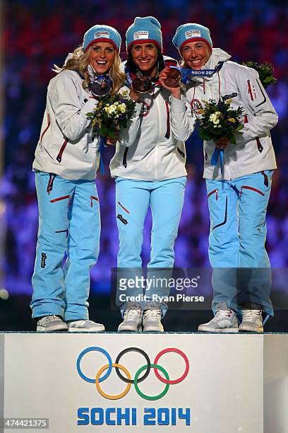 Silver medalist Therese Johaug of Norway, gold medalist Marit Bjoergen of Norway and bronze medalist Kristin Stoermer Steira of Norway celebrate in...