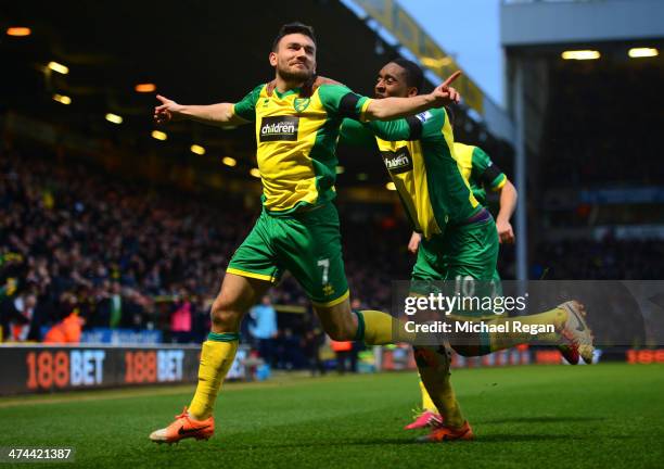 Robert Snodgrass of Norwich City celebrates scoring the opening goal with Leroy Fer of Norwich City during the Barclays Premier League match between...