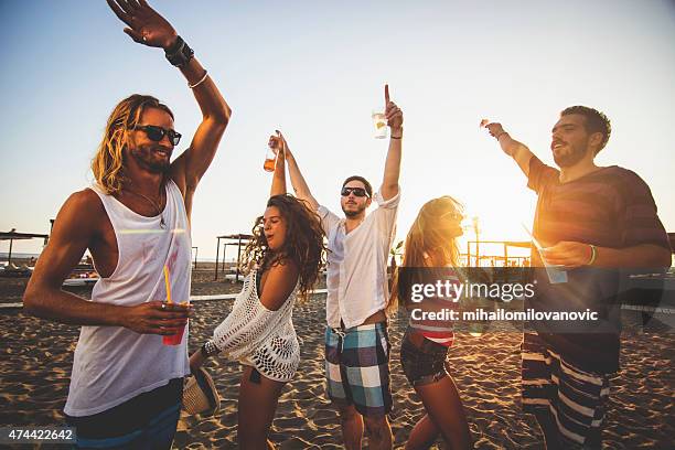 dancing at the beach - drinken stock pictures, royalty-free photos & images