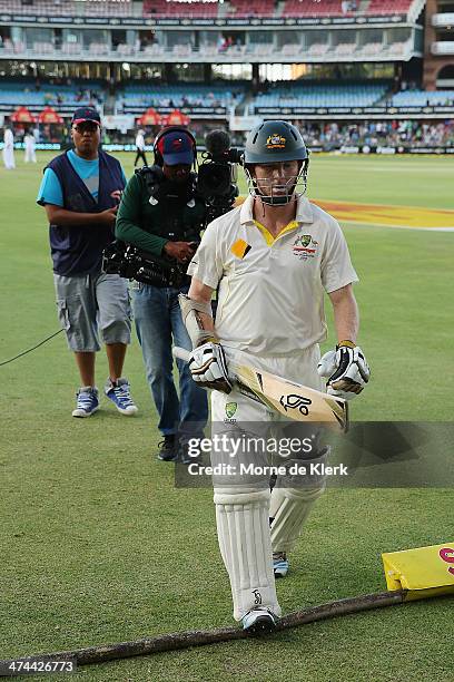 Chris Rogers of Australia leave the field after getting run-out during day four of the Second Test match between South Africa and Australia at AXXESS...