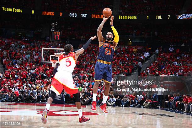 LeBron James of the Cleveland Cavaliers shoots against DeMarre Carroll of the Atlanta Hawks in Game Two of the Eastern Conference Finals during the...