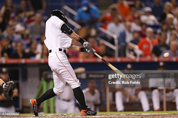 Ichiro Suzuki of the Miami Marlins gets a hit during the second inning of the game against the Baltimore Orioles at Marlins Park on May 22, 2015 in...