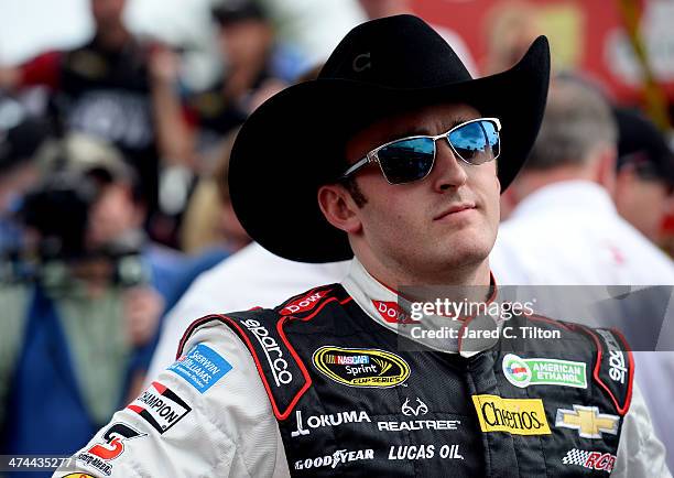 Austin Dillon, driver of the DOW Chevrolet, takes part in pre-race ceremonies for the NASCAR Sprint Cup Series Daytona 500 at Daytona International...