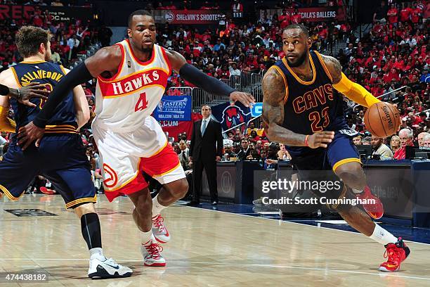 LeBron James of the Cleveland Cavaliers handles the ball against the Atlanta Hawks in Game Two of the Eastern Conference Finals of the NBA Playoffs...