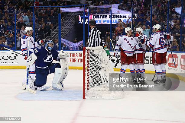 Rick Nash of the New York Rangers celebrates with his teammates after scoring a goal against Ben Bishop of the Tampa Bay Lightning during the third...
