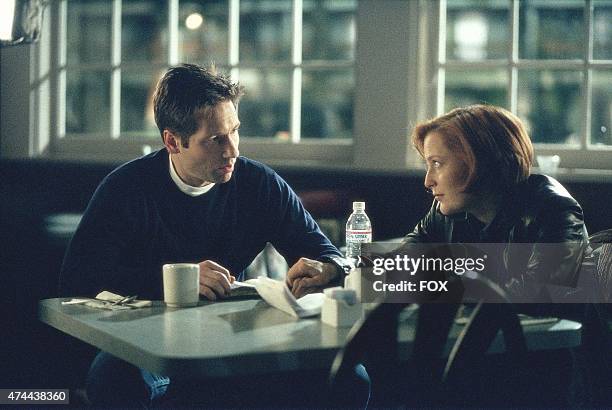 Mulder and Scully search for clues to the abduction of Mulder's sister on THE X-FILES episode "Closure" which originally aired Sunday, Feb. 13, 2000...