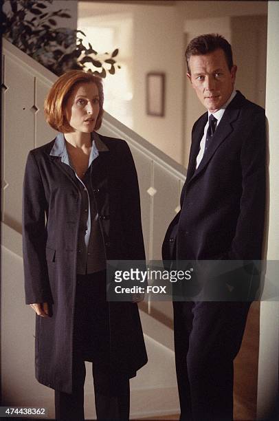 Agent Dana Scully and Agent John Doggett from the "Invocation" episode of THE X-FILES which originally aired Sun., Dec. 3 on FOX.