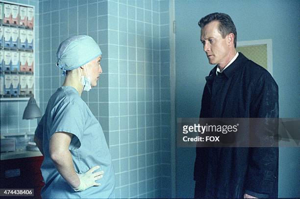 Pregnant Agent Dana Scully and Agent John Doggett , discuss Agent Mulder's condition in the "Deadalive" episode of THE X-FILES which originally aired...