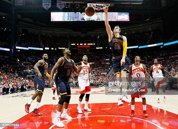 Timofey Mozgov of the Cleveland Cavaliers dunks against the Atlanta Hawks in the third quarter during Game Two of the Eastern Conference Finals of...