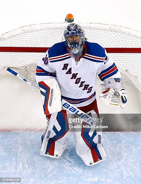 Henrik Lundqvist of the New York Rangers looks on during a break in play against the Tampa Bay Lightning in Game Four of the Eastern Conference...
