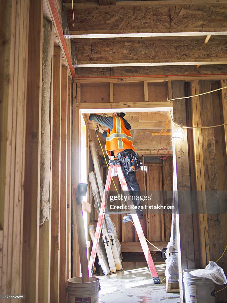 Electrician working in new construction