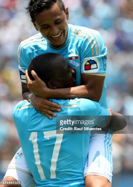 Luis Advincula and his teammates of Sporting Cristal celebrate after scoring their team's third goal against Leon de Huanuco during a match between...