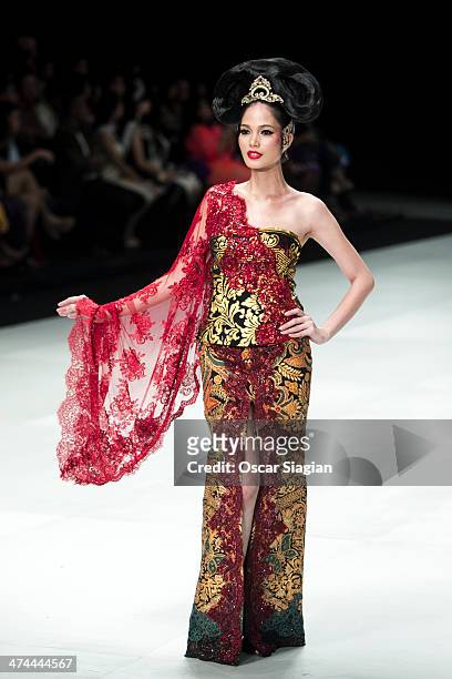 Model showcases designs by Anne Avantie on the runway during Indonesia Fashion Week 2014 day 4 at Jakarta Convention Center on February 23, 2014 in...