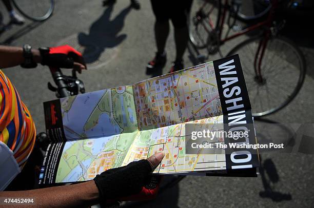 Arnetta Davis, who is a native Washingtonian, studies the newly released DC bike trail map while meeting with fellow members of Black Women Bike DC,...