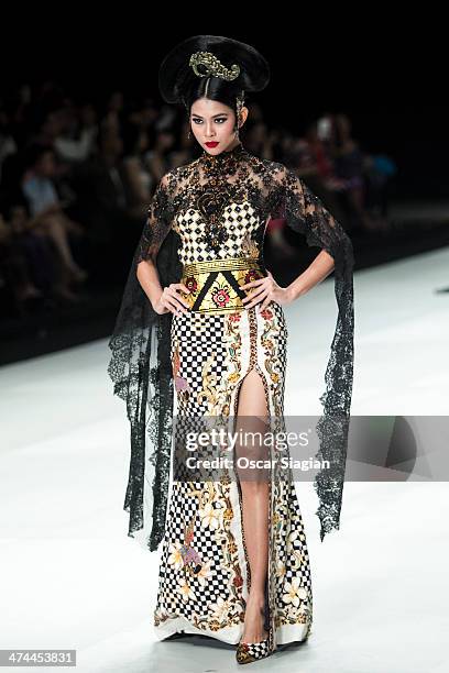 Model showcases designs by Anne Avantie on the runway during Indonesia Fashion Week 2014 day 4 at Jakarta Convention Center on February 23, 2014 in...