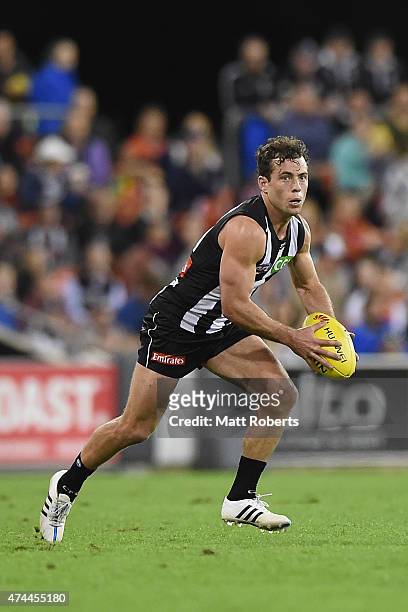 Jarryd Blair of the Magpies looks to kick the ball during the round eight AFL match between the Gold Coast Suns and the Collingwood Magpies at...