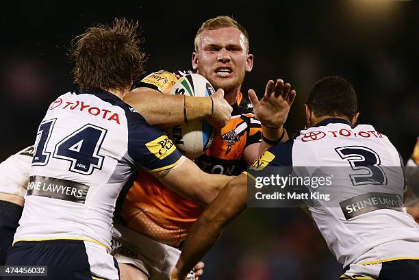 Matthew Lodge of the Tigers is tackled during the round 11 NRL match between the Wests Tigers and the North Queensland Cowboys at Campbelltown Sports...