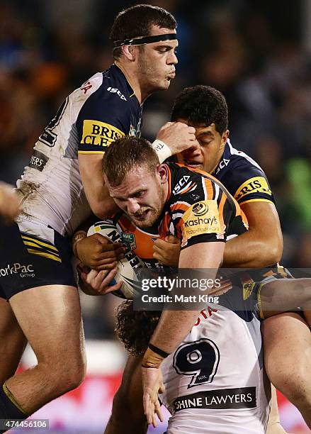 Matthew Lodge of the Tigers is tackled during the round 11 NRL match between the Wests Tigers and the North Queensland Cowboys at Campbelltown Sports...