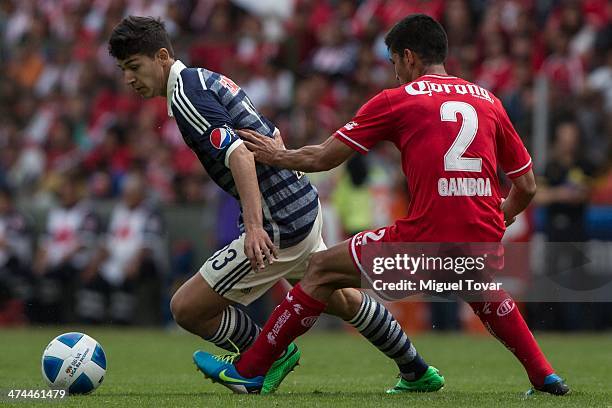Francisco Gamboa of Toluca fights for the ball with Angel Saldivar of Chivas during a match between Toluca and Chivas as part of the eighth round of...