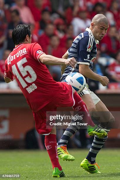 Antonio Rios of Toluca fights for the ball with Jorge Enriquez of Chivas during a match between Toluca and Chivas as part of the eighth round of the...