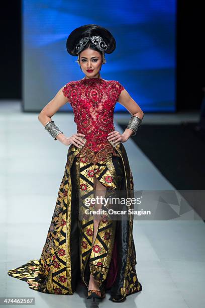 Model showcases designs by Anne Avantie on the runway during Indonesia Fashion Week 2014 day 4 at Jakarta Convention Center on February 23, 2014 in...