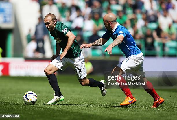Dylan McGeouch of Hibernian competes with Nicky Law of Rangers during the Scottish Championship play off semi final, second leg match between...