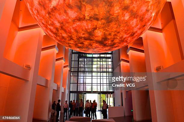 People visit Hanergy Renewable Energy Exhibition Center at the headquarters of Hanergy Holding Group Ltd. On May 22, 2015 in Beijing, China. Hanergy...