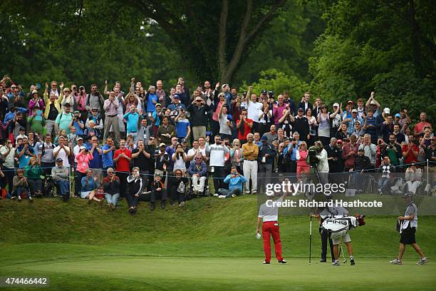 Miguel Angel Jimenez of Spain acknowledges the crowd after his hole-in-one on the 2nd hole during day 3 of the BMW PGA Championship at Wentworth on...